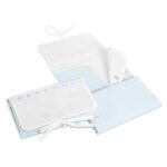 Cambiador rosa, beige, azul y blanco con cinta de raso